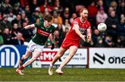 16 March 2025; Conor Glass of Derry and Fenton Kelly of Mayo during the Allianz Football League Division 1 match between Derry and Mayo at Celtic Park in Derry. Photo by Ben McShane/Sportsfile