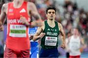 21 March 2025; Andrew Coscoran of Ireland crosses the line to finish third during the men's 1500m heats on day one of the World Indoor Athletics Championships at Nanjing's Cube Gymnasium at the Nanjing Youth Olympic Sports Park in Nanjing, China. Photo by Sportsfile