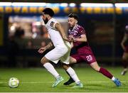 21 March 2025; Bastien Hery of Athlone Town in action against Shane Griffin of Cobh Ramblers during the SSE Airtricity Men's First Division match between Cobh Ramblers and Athlone Town at St Colman's Park in Cobh, Cork. Photo by Michael P Ryan/Sportsfile