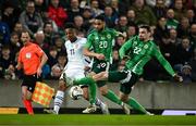 21 March 2025; Dan Ndoye of Switzerland is tackled by Brodie Spencer, centre, and Ciaron Brown of Northern Ireland during the international friendly match between Northern Ireland and Switzerland at the National Football Stadium at Windsor Park in Belfast. Photo by Ben McShane/Sportsfile