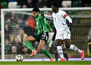 21 March 2025; Shea Charles of Northern Ireland in action against Breel Embolo of Switzerland during the international friendly match between Northern Ireland and Switzerland at the National Football Stadium at Windsor Park in Belfast. Photo by Ben McShane/Sportsfile