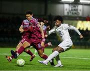 21 March 2025; Gideon Tetteh of Athlone Town in action against Nolan Evers of Cobh Ramblers during the SSE Airtricity Men's First Division match between Cobh Ramblers and Athlone Town at St Colman's Park in Cobh, Cork. Photo by Michael P Ryan/Sportsfile