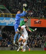 21 March 2025; Switzerland goalkeeper Gregor Kobel gathers possession ahead of Switzerland team-mate Cedric Zesiger and Dale Taylor of Northern Ireland during the international friendly match between Northern Ireland and Switzerland at the National Football Stadium at Windsor Park in Belfast. Photo by Ben McShane/Sportsfile