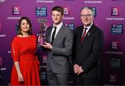 21 March 2025; Slaughtneil hurler Brendan Rogers is presented with his 2024/25 Hurling Team of the Year award by Uachtarán Cumann Lúthchleas Gael, Jarlath Burns and Chief Customer Officer of AIB, Orlaith Ryan during the AIB Club Player Awards at Croke Park in Dublin. The AIB Club Player Awards celebrated the best players from club Football, Hurling, Camogie, and LGFA in a single ceremony for the first time, recognising their outstanding achievements on the field throughout the season. Photo by Sam Barnes/Sportsfile