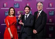 21 March 2025; Na Fianna hurler Ciarán Stacey is presented with his 2024/25 Hurling Team of the Year award by Uachtarán Cumann Lúthchleas Gael, Jarlath Burns and Chief Customer Officer of AIB, Orlaith Ryan during the AIB Club Player Awards at Croke Park in Dublin. The AIB Club Player Awards celebrated the best players from club Football, Hurling, Camogie, and LGFA in a single ceremony for the first time, recognising their outstanding achievements on the field throughout the season. Photo by Sam Barnes/Sportsfile