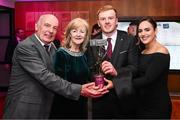 21 March 2025; Na Fianna hurler Conor McHugh with family during the AIB Club Player Awards at Croke Park in Dublin. The AIB Club Player Awards celebrated the best players from club Football, Hurling, Camogie, and LGFA in a single ceremony for the first time, recognising their outstanding achievements on the field throughout the season. Photo by Seb Daly/Sportsfile