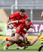 22 March 2025; Stewart Moore of Ulster is tackled by Dylan Kelleher-Griffiths of Dragons during the United Rugby Championship match between Dragons and Ulster at Rodney Parade in Newport, Wales. Photo by Chris Fairweather/Sportsfile