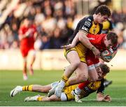 22 March 2025; Jack Murphy of Ulster is tackled by Joe Westwood and Huw Anderson of Dragons during the United Rugby Championship match between Dragons and Ulster at Rodney Parade in Newport, Wales. Photo by Chris Fairweather/Sportsfile