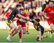 22 March 2025; Jack Murphy of Ulster is tackled by Joe Westwood and Huw Anderson of Dragons during the United Rugby Championship match between Dragons and Ulster at Rodney Parade in Newport, Wales. Photo by Chris Fairweather/Sportsfile
