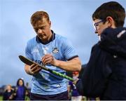 22 March 2025; Conor McHugh of Dublin signs a supporter's hurley after the Allianz Hurling League Division 1B match between Laois and Dublin at Laois Hire O'Moore Park in Portlaoise, Laois. Photo by Thomas Flinkow/Sportsfile