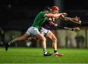 22 March 2025; Lee Chin of Wexford is tackled by Cian Scully of Limerick during the Allianz Hurling League Division 1A match between Limerick and Wexford at TUS Gaelic Grounds in Limerick. Photo by Tom Beary/Sportsfile