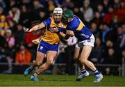 22 March 2025; Jack Kirwan of Clare is tackled by Robert Doyle of Tipperary during the Allianz Hurling League Division 1A match between Tipperary and Clare at FBD Semple Stadium in Thurles, Tipperary. Photo by Ben McShane/Sportsfile