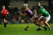 22 March 2025; Jack Redmond of Wexford is tackled by Darragh O'Donovan of Limerick during the Allianz Hurling League Division 1A match between Limerick and Wexford at TUS Gaelic Grounds in Limerick. Photo by Tom Beary/Sportsfile
