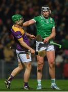 22 March 2025; Richie Lawlor of Wexford tussles with Gearoid Hegarty of Limerick during the Allianz Hurling League Division 1A match between Limerick and Wexford at TUS Gaelic Grounds in Limerick. Photo by John Sheridan/Sportsfile