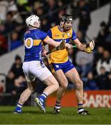 22 March 2025; Cathal Malone of Clare is tackled by Seamus Kennedy of Tipperary during the Allianz Hurling League Division 1A match between Tipperary and Clare at FBD Semple Stadium in Thurles, Tipperary. Photo by Ben McShane/Sportsfile