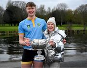22 March 2025; Paul Flood of the UCD Senior Men's team with his mother Caitríona Horgan after winning the Gannon Cup in the 75th annual Colours Boat Race between UCD and Trinity College on the River Liffey in Dublin. Photo by Shauna Clinton/Sportsfile