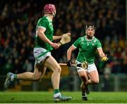 22 March 2025; Darragh O'Donovan of Limerick hand-passes to teammate Shane O'Brien during the Allianz Hurling League Division 1A match between Limerick and Wexford at TUS Gaelic Grounds in Limerick. Photo by Tom Beary/Sportsfile