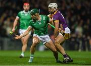 22 March 2025; Sean Finn of Limerick in action against Rory O'Connor of Wexford during the Allianz Hurling League Division 1A match between Limerick and Wexford at TUS Gaelic Grounds in Limerick. Photo by John Sheridan/Sportsfile