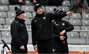 22 March 2025; Offaly manager Johnny Kelly, left, and hurley carrier Séamus Callanan before the Allianz Hurling League Division 1B match between Waterford and Offaly at Walsh Park in Waterford. Photo by Seb Daly/Sportsfile