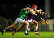 22 March 2025; Lee Chin of Wexford is tackled by Cian Scully of Limerick during the Allianz Hurling League Division 1A match between Limerick and Wexford at TUS Gaelic Grounds in Limerick. Photo by Tom Beary/Sportsfile