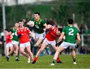 23 March 2025; Jordan Morris of Meath in action against Andy McDonnell of Louth during the Allianz Football League Division 2 match between Louth and Meath at Grattan Park in Inniskeen, Monaghan. Photo by Daire Brennan/Sportsfile