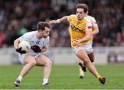 23 March 2025; Niall Kelly of Kildare in action against Eoghan McCabe of Antrim during the Allianz Football League Division 3 match between Kildare and Antrim at Cedral St. Conleth's Park in Newbridge, Kildare. Photo by Thomas Flinkow/Sportsfile