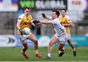 23 March 2025; Conhuir Johnston of Antrim in action against Niall Kelly of Kildare during the Allianz Football League Division 3 match between Kildare and Antrim at Cedral St. Conleth's Park in Newbridge, Kildare. Photo by Thomas Flinkow/Sportsfile