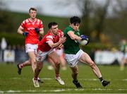 23 March 2025; Eoin Harkin of Meath in action against Peter Lynch of Louth during the Allianz Football League Division 2 match between Louth and Meath at Grattan Park in Inniskeen, Monaghan. Photo by Daire Brennan/Sportsfile