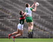 23 March 2025; Hugh McFadden of Donegal in action against Aidan O'Shea of Mayo during the Allianz Football League Division 1 match between Mayo and Donegal at Hastings Insurance MacHale Park in Castlebar, Mayo. Photo by Piaras Ó Mídheach/Sportsfile