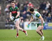 23 March 2025; Matthew Ruane of Mayo in action against Caolan McColgan of Donegal during the Allianz Football League Division 1 match between Mayo and Donegal at Hastings Insurance MacHale Park in Castlebar, Mayo. Photo by Piaras Ó Mídheach/Sportsfile
