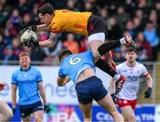 23 March 2025; Tyrone goalkeeper Niall Morgan is fouled by Seán McMahon of Dublin during the Allianz Football League Division 1 match between Tyrone and Dublin at O'Neills Healy Park in Omagh, Tyrone. Photo by Ray McManus/Sportsfile