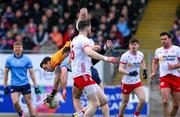 23 March 2025; Tyrone goalkeeper Niall Morgan is fouled by Seán McMahon of Dublin during the Allianz Football League Division 1 match between Tyrone and Dublin at O'Neills Healy Park in Omagh, Tyrone. Photo by Ray McManus/Sportsfile