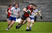 23 March 2025; Daniel Guinness of Down in action against Ryan Wylie of Monaghan during the Allianz Football League Division 2 match between Monaghan and Down at St Tiernach’s Park in Clones, Monaghan. Photo by Philip Fitzpatrick/Sportsfile