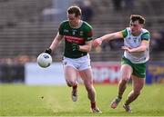 23 March 2025; Matthew Ruane in action against Luke McGlynn of Donegal during the Allianz Football League Division 1 match between Mayo and Donegal at Hastings Insurance MacHale Park in Castlebar, Mayo. Photo by Piaras Ó Mídheach/Sportsfile