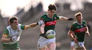 23 March 2025; Fenton Kelly of Mayo in action against Finbarr Roarty of Donegal during the Allianz Football League Division 1 match between Mayo and Donegal at Hastings Insurance MacHale Park in Castlebar, Mayo. Photo by Piaras Ó Mídheach/Sportsfile