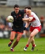 23 March 2025; Stefan Campbell of Armagh in action against Padraig McGrogan of Derry during the Allianz Football League Division 1 match between Armagh and Derry at BOX-IT Athletic Grounds in Armagh. Photo by Ramsey Cardy/Sportsfile