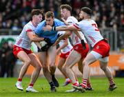 23 March 2025; Peadar Ó Cofaigh Byrne of Dublin in action against Aodhan Donaghy, left, and Brian Kennedy and Peter Teague of Tyrone during the Allianz Football League Division 1 match between Tyrone and Dublin at O'Neills Healy Park in Omagh, Tyrone. Photo by Ray McManus/Sportsfile