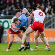 23 March 2025; Peadar Ó Cofaigh Byrne of Dublin in action against Aodhan Donaghy, left, and Brian Kennedy of Tyrone during the Allianz Football League Division 1 match between Tyrone and Dublin at O'Neills Healy Park in Omagh, Tyrone. Photo by Ray McManus/Sportsfile