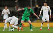 23 March 2025; Josh Cullen of Republic of Ireland in action against Bozhidar Kraev of Bulgaria during the UEFA Nations League B/C Play-off 2nd Leg match between Republic of Ireland and Bulgaria at the Aviva Stadium in Dublin. Photo by Thomas Flinkow/Sportsfile