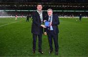 23 March 2025; Former Republic of Ireland international Niall Quinn, right, is presented with a Hall of Fame award by FAI President Paul Cooke during the UEFA Nations League B/C Play-off 2nd Leg match between Republic of Ireland and Bulgaria at the Aviva Stadium in Dublin. Photo by Stephen McCarthy/Sportsfile