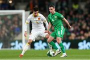 23 March 2025; Josh Cullen of Republic of Ireland in action against Ilia Gruev of Bulgaria during the UEFA Nations League B/C Play-off 2nd Leg match between Republic of Ireland and Bulgaria at the Aviva Stadium in Dublin. Photo by Thomas Flinkow/Sportsfile