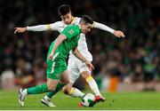 23 March 2025; Josh Cullen of Republic of Ireland in action against Bozhidar Kraev of Bulgaria during the UEFA Nations League B/C Play-off 2nd Leg match between Republic of Ireland and Bulgaria at the Aviva Stadium in Dublin. Photo by Thomas Flinkow/Sportsfile