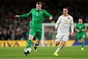 23 March 2025; Jake O'Brien of Republic of Ireland in action against Bozhidar Kraev of Bulgaria during the UEFA Nations League B/C Play-off 2nd Leg match between Republic of Ireland and Bulgaria at the Aviva Stadium in Dublin. Photo by Thomas Flinkow/Sportsfile