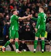 23 March 2025; Evan Ferguson of Republic of Ireland, left, celebrates with team-mate Jake O'Brien of Republic of Ireland after scoring their side's first goal during the UEFA Nations League B/C Play-off 2nd Leg match between Republic of Ireland and Bulgaria at the Aviva Stadium in Dublin. Photo by Ben McShane/Sportsfile