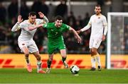 23 March 2025; Finn Azaz of Republic of Ireland in action against Simeon Petrov of Bulgaria during the UEFA Nations League B/C Play-off 2nd Leg match between Republic of Ireland and Bulgaria at the Aviva Stadium in Dublin. Photo by Ben McShane/Sportsfile