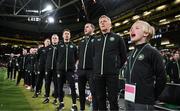 23 March 2025; Special guest Freddie Munnelly stands alongside Republic of Ireland head coach Heimir Hallgrimsson and his staff during the playing of the national anthems before the UEFA Nations League B/C Play-off 2nd Leg match between Republic of Ireland and Bulgaria at the Aviva Stadium in Dublin. Photo by Stephen McCarthy/Sportsfile
