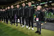 23 March 2025; Special guest Freddie Munnelly stands alongside Republic of Ireland head coach Heimir Hallgrimsson and his staff during the playing of the national anthems before the UEFA Nations League B/C Play-off 2nd Leg match between Republic of Ireland and Bulgaria at the Aviva Stadium in Dublin. Photo by Stephen McCarthy/Sportsfile