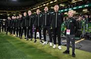 23 March 2025; Special guest Freddie Munnelly stands alongside Republic of Ireland head coach Heimir Hallgrimsson and his staff during the playing of the national anthems before the UEFA Nations League B/C Play-off 2nd Leg match between Republic of Ireland and Bulgaria at the Aviva Stadium in Dublin. Photo by Stephen McCarthy/Sportsfile