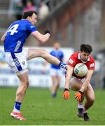 23 March 2025; Gearoid McKiernan of Cavan has his shot blocked by Chris Og Jones of Cork during the Allianz Football League Division 2 match between Cavan and Cork at Kingspan Breffni in Cavan. Photo by Matt Browne/Sportsfile