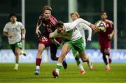 24 March 2025; Mason Melia of Republic of Ireland in action against Rajmund Toth of Hungary during the U21 International Friendly match between Republic of Ireland and Hungary at Pinatar Arena in Murcia, Spain. Photo by Manu Reino/Sportsfile